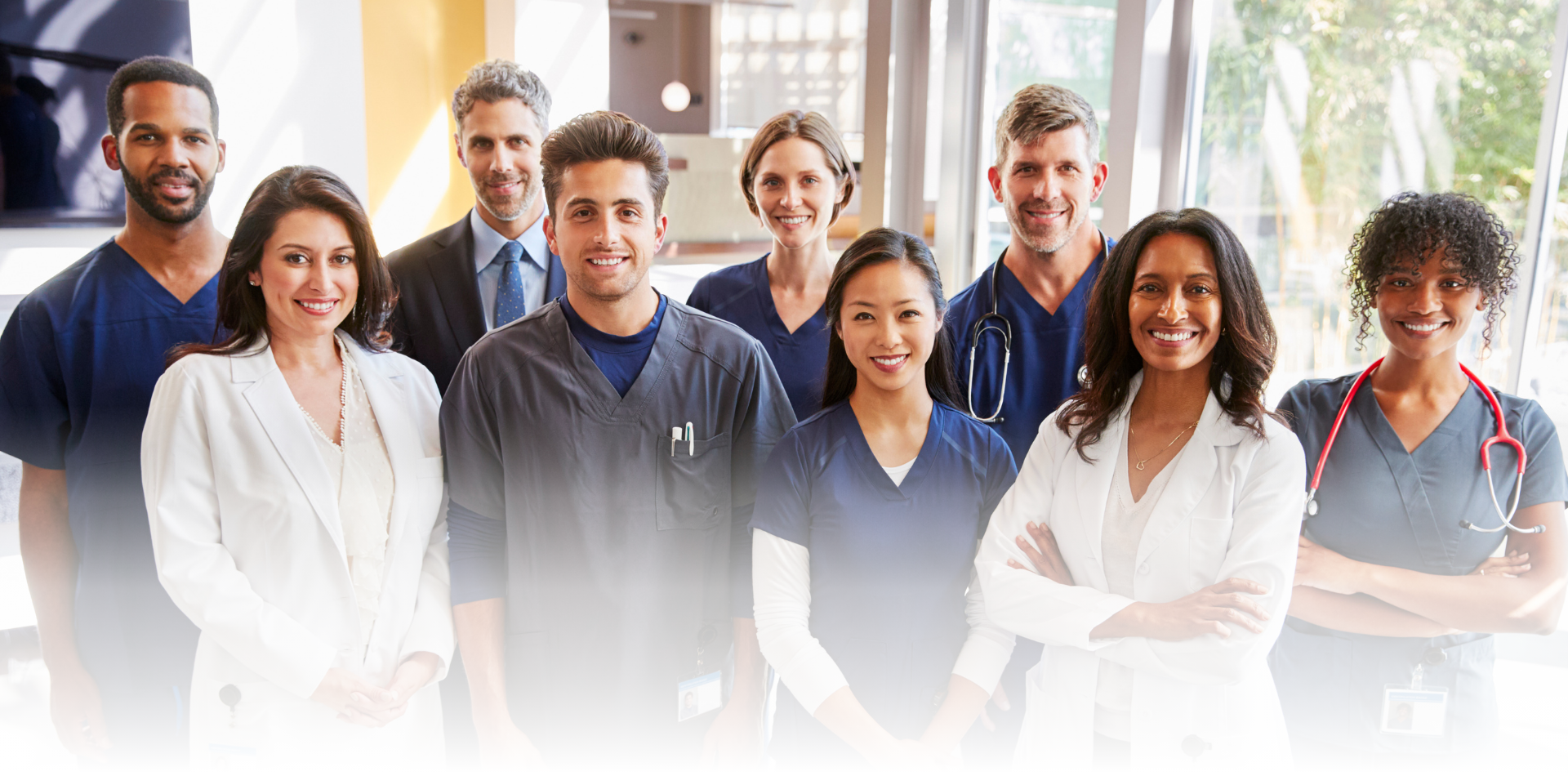 CV New cover image features healthcare practictioners (doctors, nurses, admins, surgeons etc) standing in a hosptial and smiling